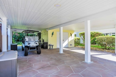 View of patio featuring a carport
