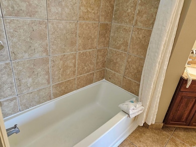 Bathroom with tile patterned flooring and vanity