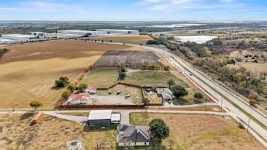 Aerial view of property and surrounding area with property boundaries highlighted