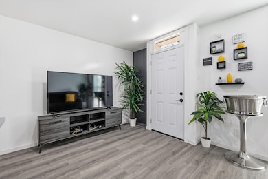 Foyer featuring light wood-type flooring and baseboards