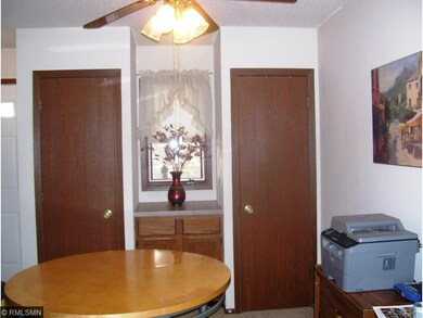 Closets frame window, storage cabinetry in Dining 