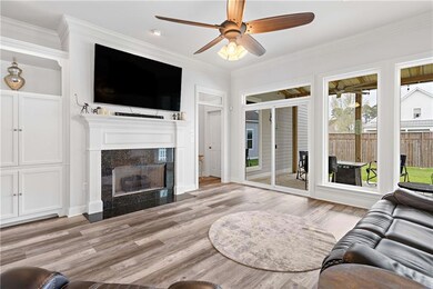 Den has electric or gas Fireplace and wall of wind