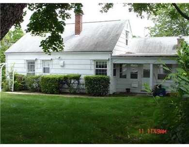 Exterior Back. Three season room on right overlook