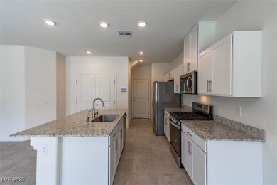 Kitchen featuring appliances with stainless steel