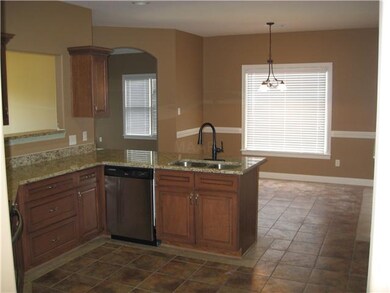 The decorative tile floors run thru the kitchen, b