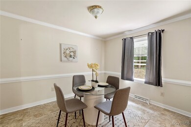 Dining Room featuring crown molding, chair rail an
