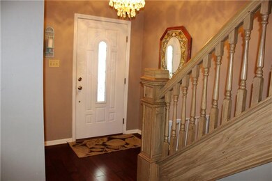 Entryway with Beautiful Staircase and Bamboo Floor