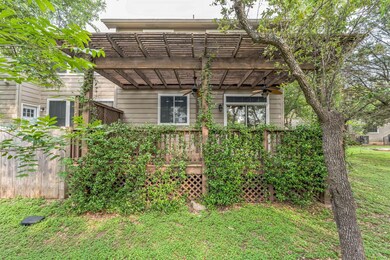 Rear view of property featuring ceiling fan, a pe