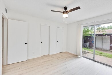 Unfurnished bedroom with access to exterior, wood