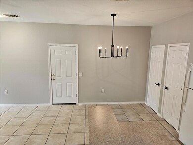 Unfurnished dining area with a chandelier, light 