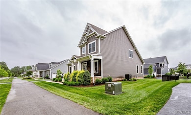 View of side of home featuring a residential view