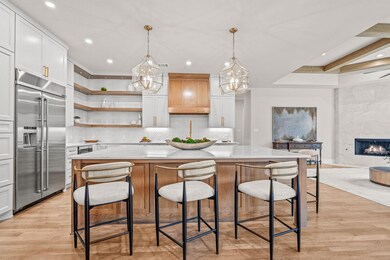 The wood floors and open shelving bring warmth to 