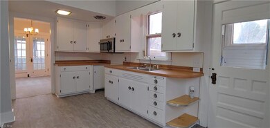 Loads of cabinets in the big kitchen