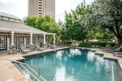 View of swimming pool with fence, a patio area, an