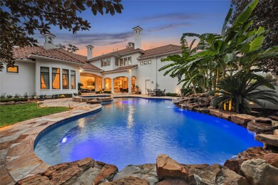 The backyard oasis includes a fire pit, custom out