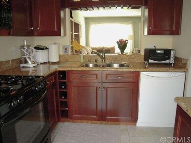 The kitchen overlooks the dining area and spacious