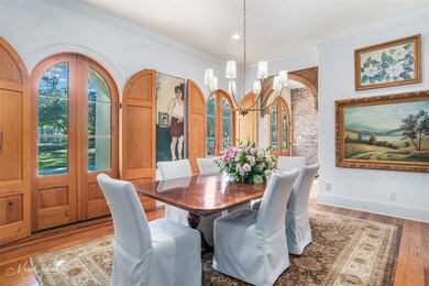 Dining room with hardwood / wood-style floors, a n