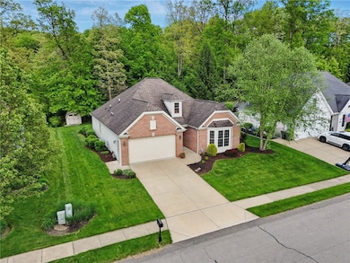 Classic brick exterior with all concrete drive way