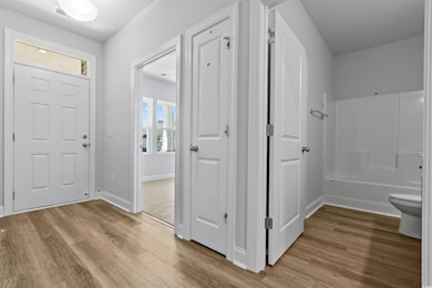 Foyer entrance with light hardwood / wood-style fl