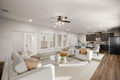 Living room featuring dark wood-style floors, vis