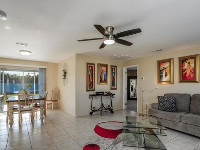 Spacious living room with large tile flooring and 