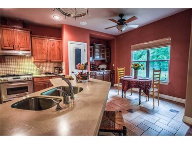 Kitchen. Tons of cabinets and breakfast nook.