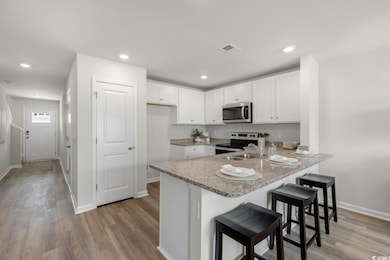 Kitchen featuring light hardwood / wood-style floo
