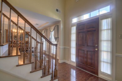 The 2 story entry features an abundant amount of n