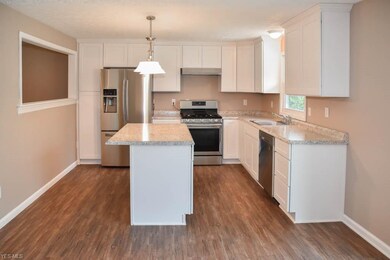 Brand new kitchen with new white cabinets and coun