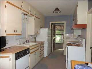 Kitchen is oversized. There is a counter on the wa