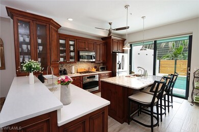 Kitchen featuring pendant lighting, sink, tasteful