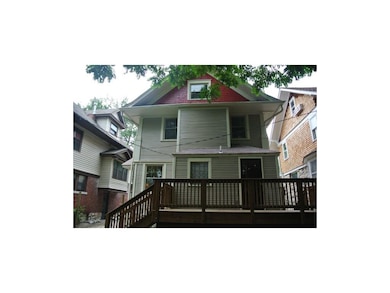 Rear of home.  New deck.  Lots of windows.
