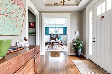 Inside, the foyer greets you with hardwood floors 