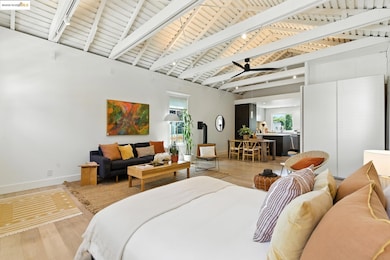 Bedroom with wood finished floors, multiple windows, and wood ceiling