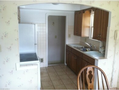 Kitchen updated in 2002 with new cabinets and quar
