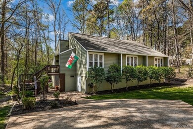 Wide aggregate driveway leads you to the front doo