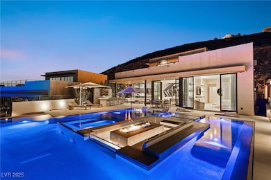 Outdoor pool featuring an in-ground hot tub, an ou
