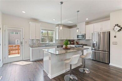 Kitchen with a sink, dark wood finished floors, a 
