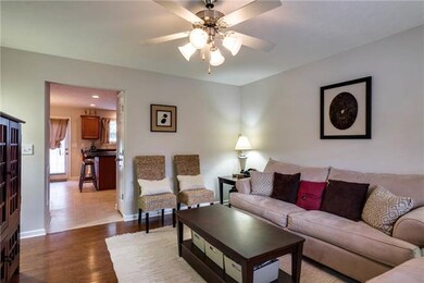 Walk in to the large living room with hardwood flo