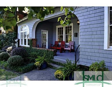 Exterior Front. A deep front porch welcomes guests