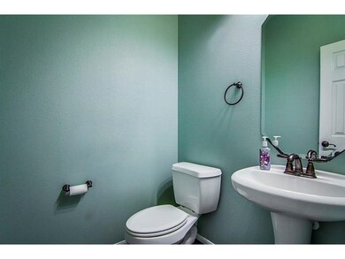 This is a small  guest bathroom with a pedestal si