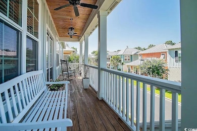 Balcony with ceiling fan and a residential view