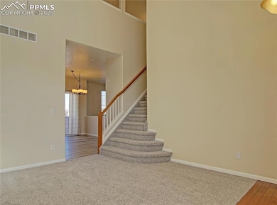 Staircase leading up to four bedrooms