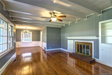 Living room ceiling is stunning so are the wood fl