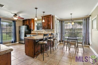 Undated kitchen with slab granite, built-in wine c