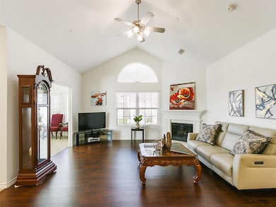 Living area with visible vents, baseboards, ceilin