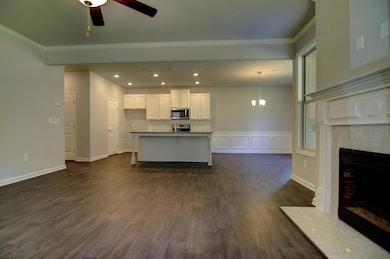 Unfurnished living room with ceiling fan with nota