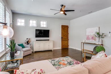 Living area featuring dark wood-style floors and a