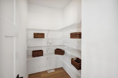 (Photo of a decorated model, actual homes finishes will vary) Enjoy a spacious pantry!