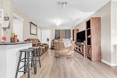 Living room with light wood-type flooring